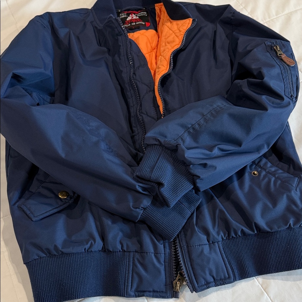 Stylish Blue Bomber Jacket with Vibrant Orange Interior. Size L
